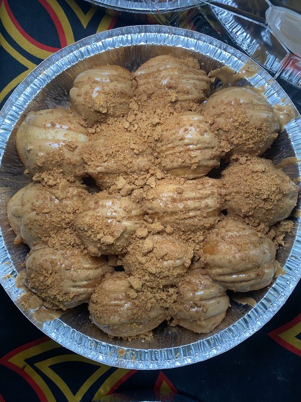 Cookie butter beignets with cookie butter drizzle and crumble